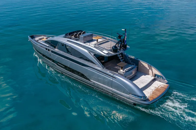 Ciao Yacht Photos Pics 2025 Pershing GTX 80 yacht cruising on clear blue water.