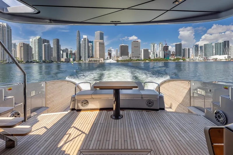 Ciao Yacht Photos Pics Luxury Pershing GTX 80 yacht cruising with city skyline view, 2025 model.
