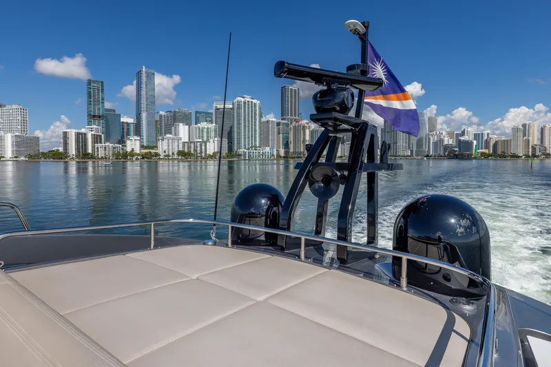Ciao Yacht Photos Pics 2025 Pershing GTX 80 yacht cruising with city skyline in the background.