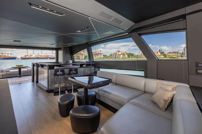 Ciao Yacht Photos Pics Luxurious interior of 2025 Pershing GTX 80 yacht with modern seating and waterfront view.