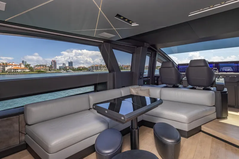Ciao Yacht Photos Pics Luxurious interior of 2025 Pershing GTX 80 yacht with modern seating and scenic views.