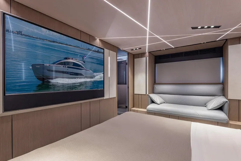 Ciao Yacht Photos Pics Luxurious interior of 2025 Pershing GTX 80 yacht with modern design and large screen.