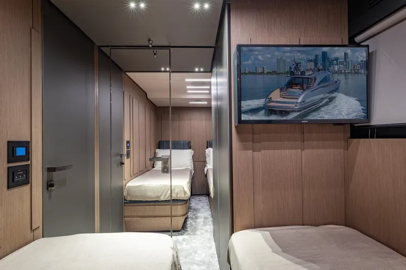 Ciao Yacht Photos Pics Luxurious interior of 2025 Pershing GTX 80 yacht with modern design and TV display.