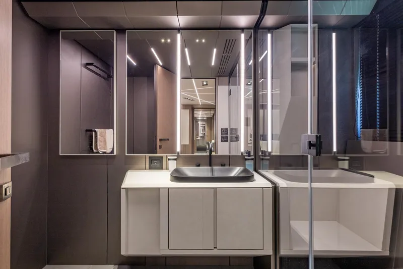 Ciao Yacht Photos Pics Luxurious bathroom interior on 2025 Pershing GTX 80 yacht, featuring modern design and sleek fixtures.