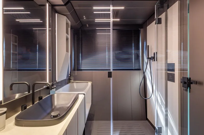 Ciao Yacht Photos Pics Modern bathroom interior of 2025 Pershing GTX 80 yacht with sleek design and glass shower.