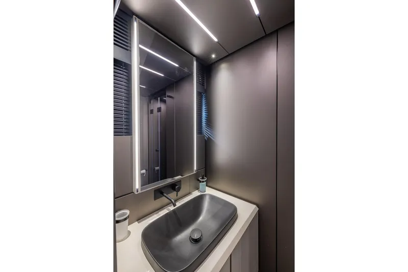 Ciao Yacht Photos Pics Modern bathroom interior of 2025 Pershing GTX 80 yacht with sleek design and lighting.