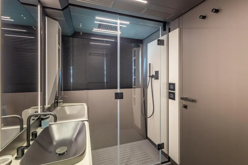 Ciao Yacht Photos Pics Modern bathroom interior on Pershing GTX 80 yacht, featuring sleek design and glass shower.