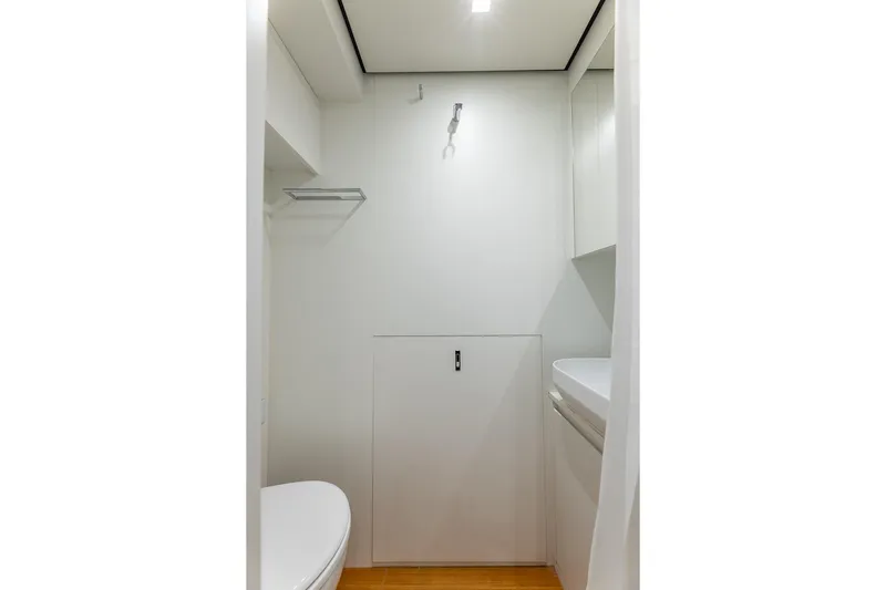 Ciao Yacht Photos Pics Compact bathroom interior in 2025 Pershing GTX 80 yacht, featuring modern fixtures and minimalist design.