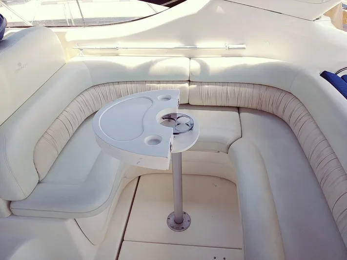  Yacht Photos Pics Luxurious seating area on a 2000 Cranchi Endurance 39 yacht with a compact table.