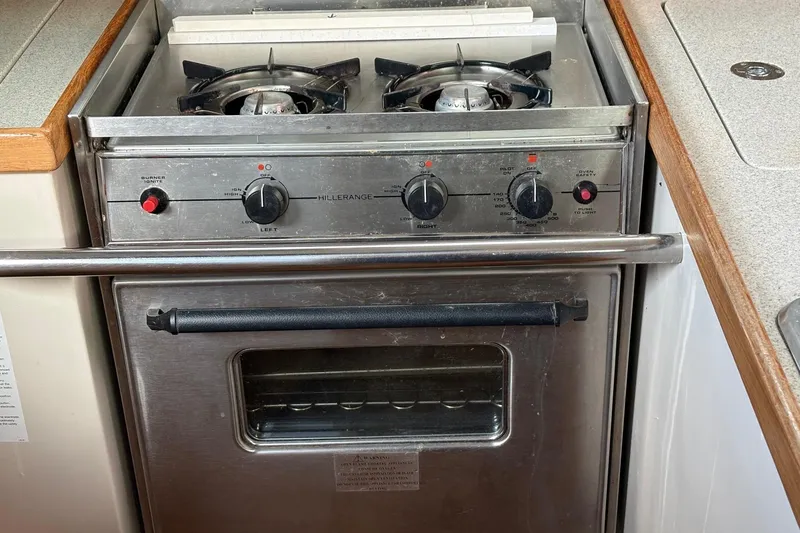 Kindred Spirit Yacht Photos Pics Stainless steel stove and oven in 2005 Catalina 36 MkII yacht kitchen.