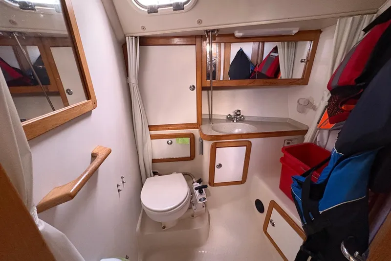 Kindred Spirit Yacht Photos Pics Compact bathroom in a 2005 Catalina 36 MkII sailboat, featuring a toilet and sink.