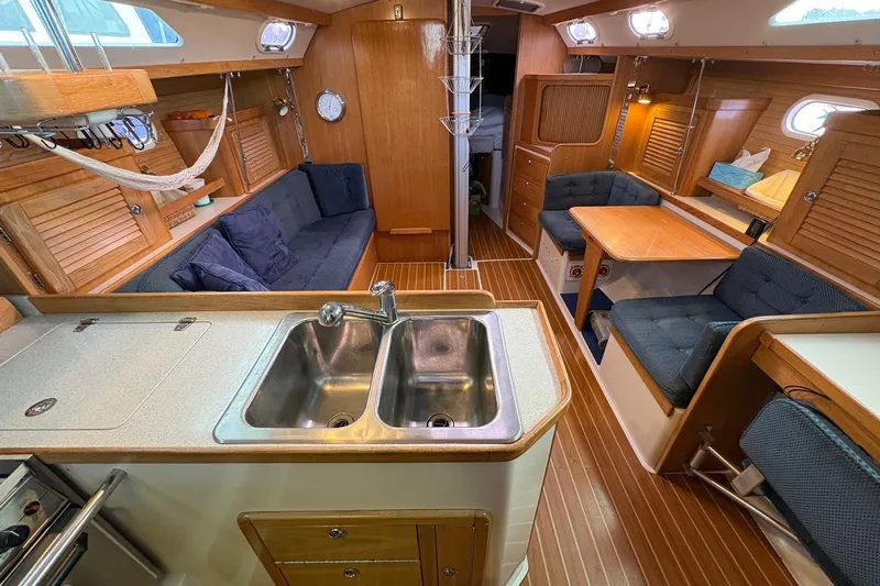 Kindred Spirit Yacht Photos Pics Interior of 2005 Catalina 36 MkII sailboat with wood finish and cozy seating.