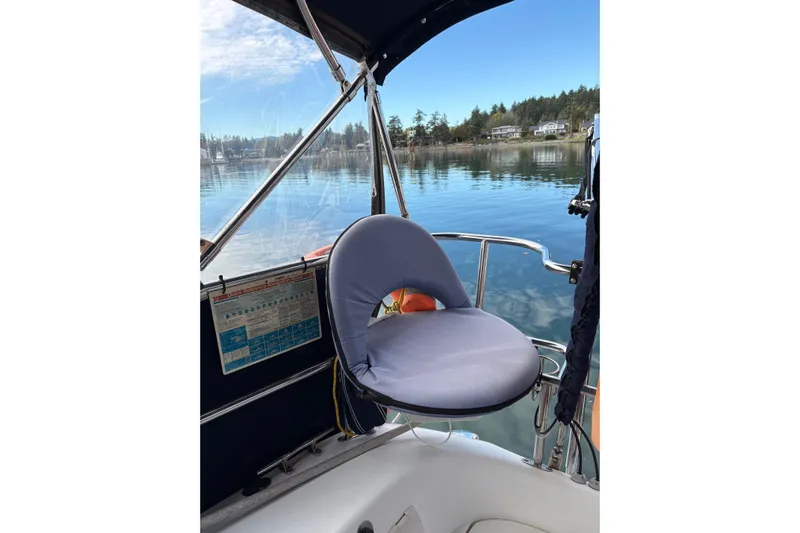 Kindred Spirit Yacht Photos Pics Cockpit of 2005 Catalina 36 MkII sailboat with cushioned seat and scenic water view.