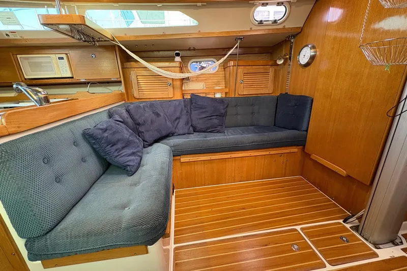 Kindred Spirit Yacht Photos Pics Interior of 2005 Catalina 36 MkII sailboat with cozy seating and wooden finishes.