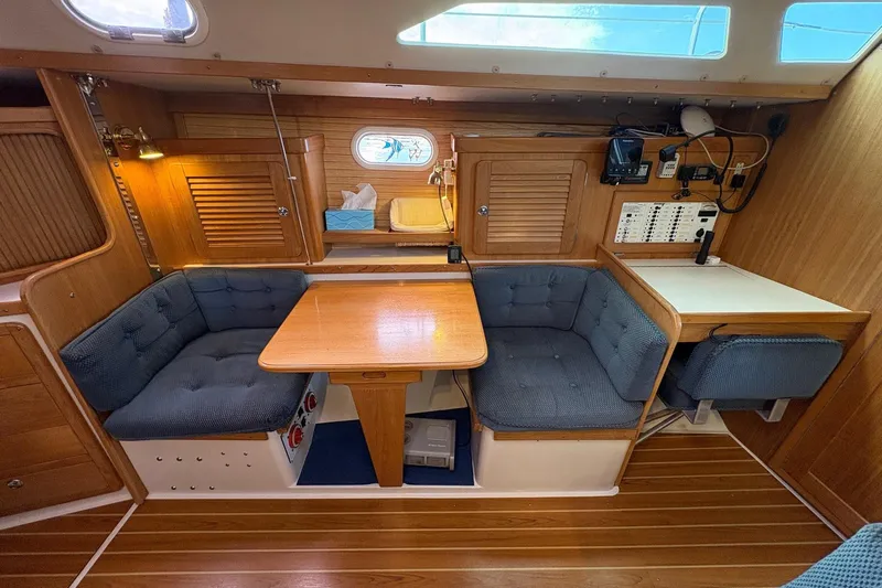Kindred Spirit Yacht Photos Pics Interior of 2005 Catalina 36 MkII sailboat with cozy seating and wooden finishes.