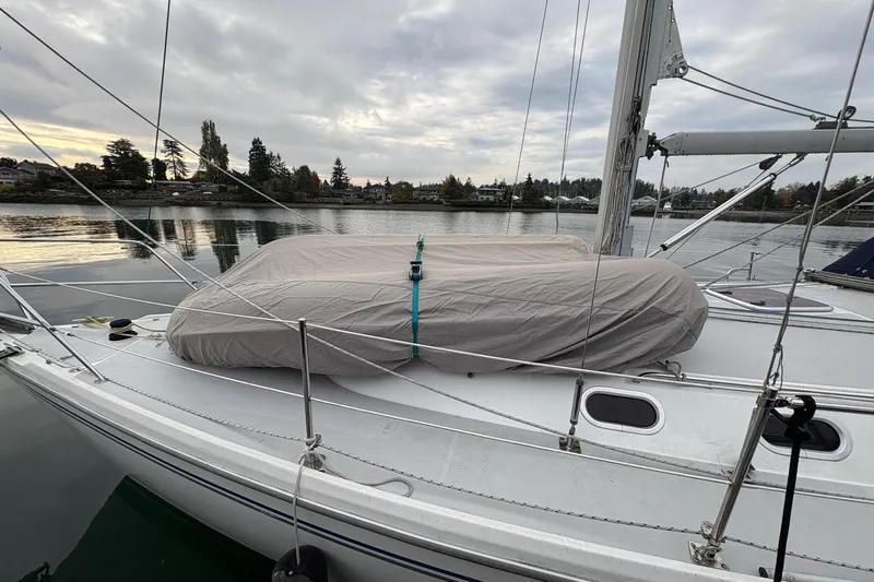 Kindred Spirit Yacht Photos Pics 2005 Catalina 36 MkII sailboat docked, covered dinghy on deck, overcast sky.