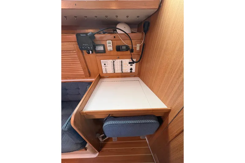 Kindred Spirit Yacht Photos Pics 2005 Catalina 36 MkII navigation station with control panel and seating.