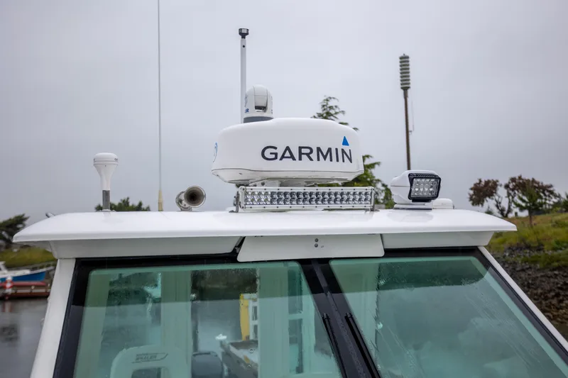 Boston Whaler 285 Yacht Photos Pics 2013 Boston Whaler 285 Conquest Pilothouse with Garmin radar on roof.