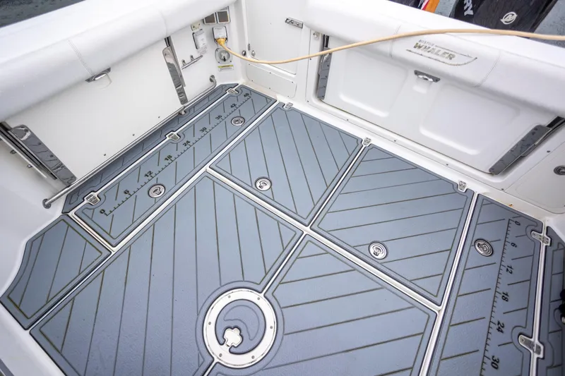 Boston Whaler 285 Yacht Photos Pics 2013 Boston Whaler 285 Conquest Pilothouse deck with non-slip flooring and storage compartments.