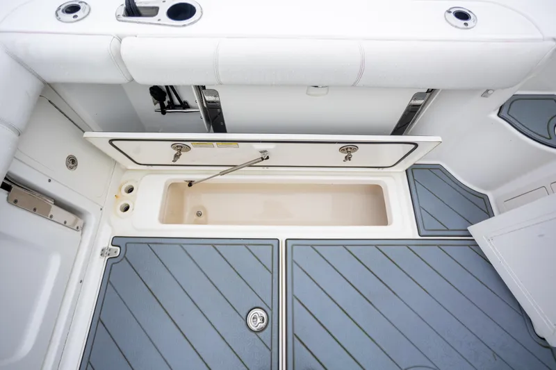 Boston Whaler 285 Yacht Photos Pics 2013 Boston Whaler 285 Conquest Pilothouse deck with storage compartment open.