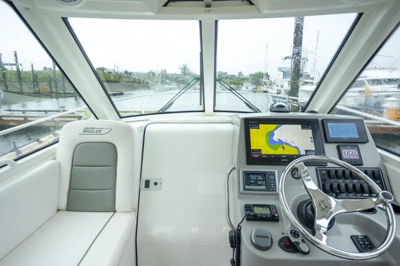 Boston Whaler 285 Yacht Photos Pics Interior view of 2013 Boston Whaler 285 Conquest Pilothouse with navigation equipment.