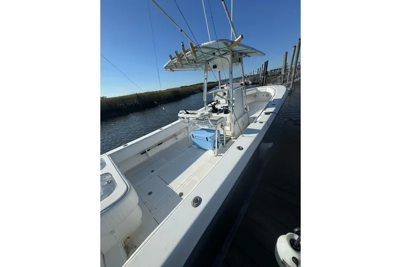 Elizabeth II Yacht Photos Pics 2001 Contender 31 Open boat docked, featuring spacious deck and fishing equipment.