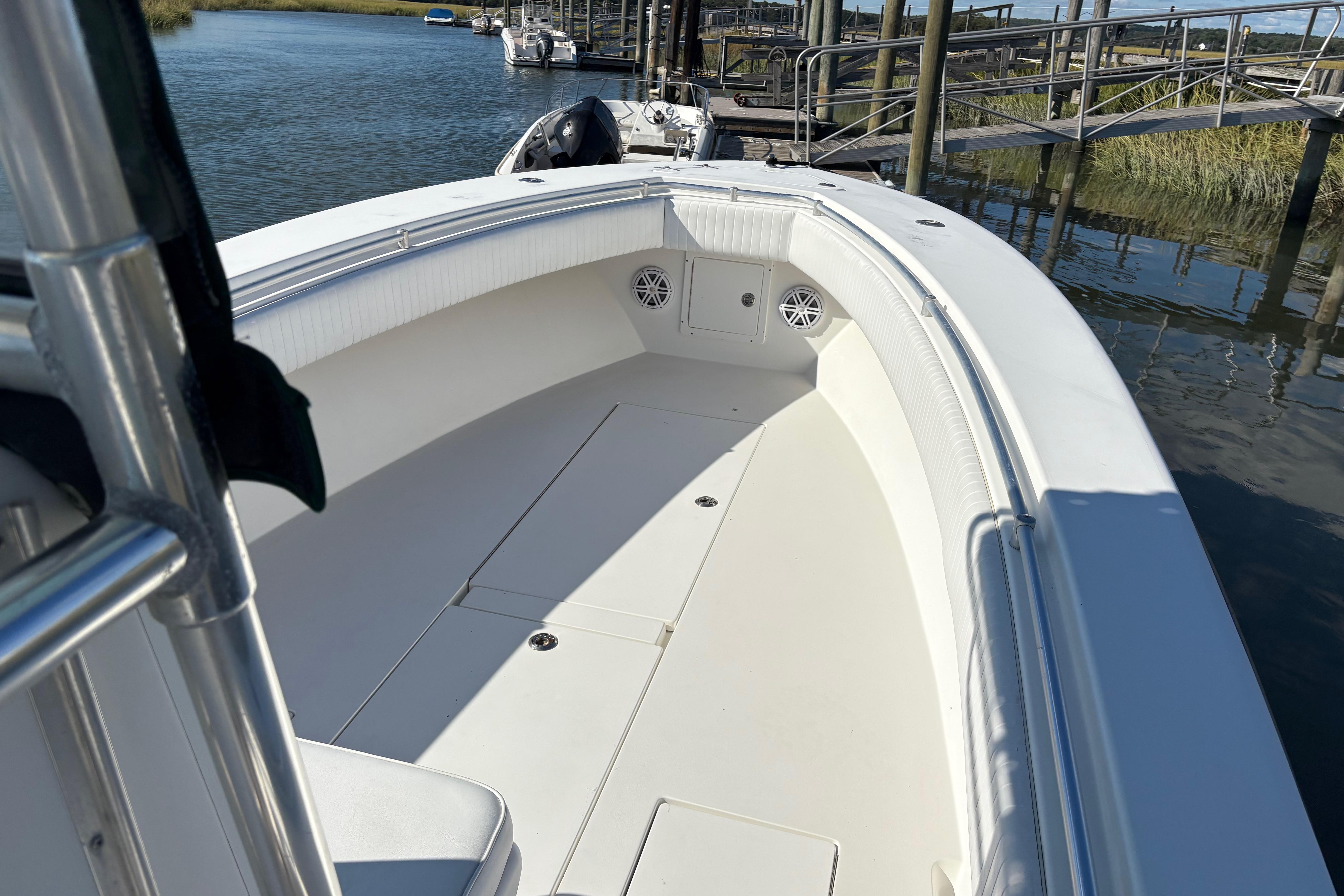 2001 Contender 31 Open boat docked, showcasing spacious deck and sleek design.