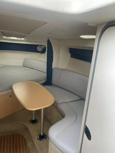 2012 Bayliner 335 Sb @ Veracruz Yacht Photos Pics Interior of 2012 Bayliner 335 Cruiser with seating and table.