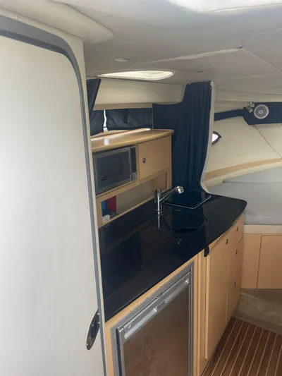 2012 Bayliner 335 Sb @ Veracruz Yacht Photos Pics 2012 Bayliner 335 Cruiser interior with kitchenette and modern amenities.