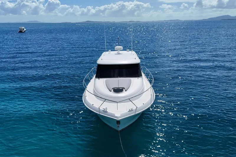  Yacht Photos Pics 2022 Tiara Yachts C39 Coupe on clear blue ocean waters.