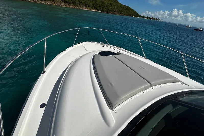  Yacht Photos Pics 2022 Tiara Yachts C39 Coupe on clear blue water, featuring sleek deck design.