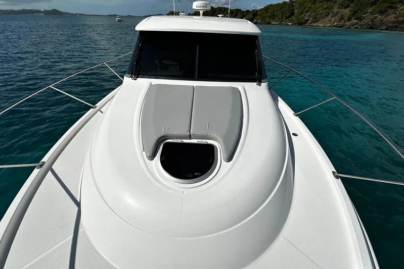  Yacht Photos Pics 2022 Tiara Yachts C39 Coupe on serene blue waters, showcasing sleek deck design.