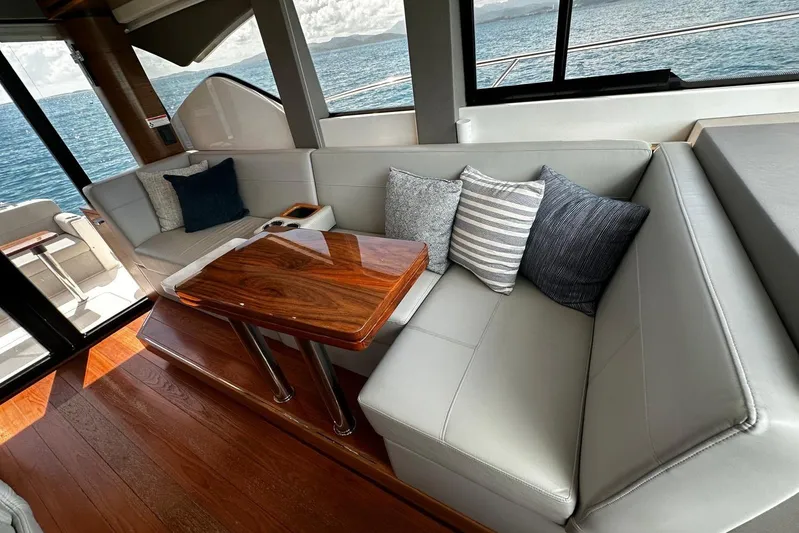  Yacht Photos Pics Luxurious interior of 2022 Tiara Yachts C39 Coupe with elegant seating and ocean view.