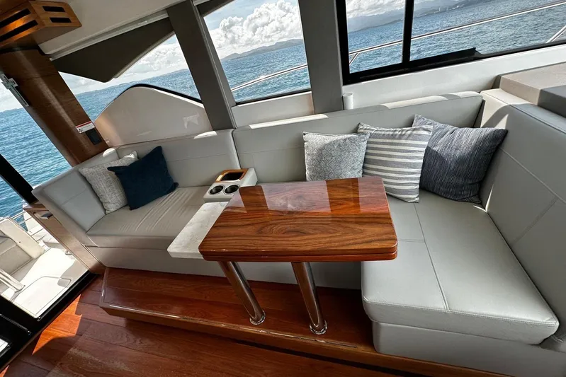  Yacht Photos Pics Luxurious interior of 2022 Tiara Yachts C39 Coupe with elegant seating and ocean view.