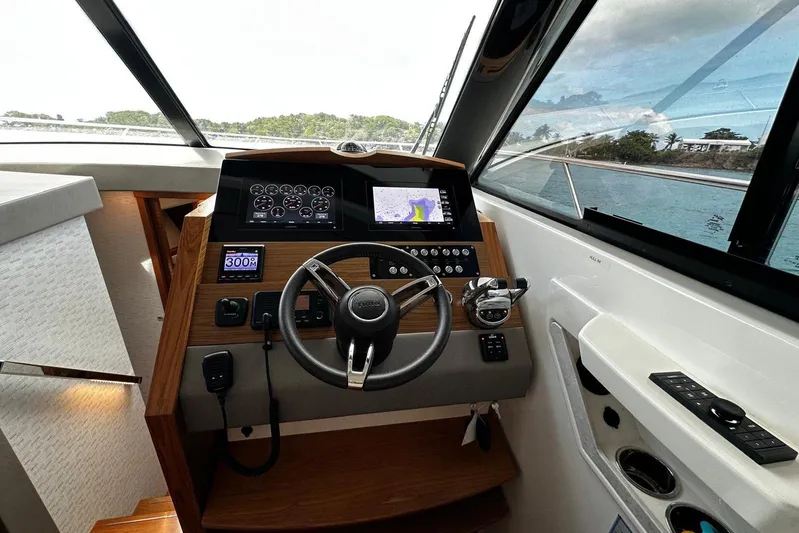  Yacht Photos Pics 2022 Tiara Yachts C39 Coupe helm with modern navigation and control systems.