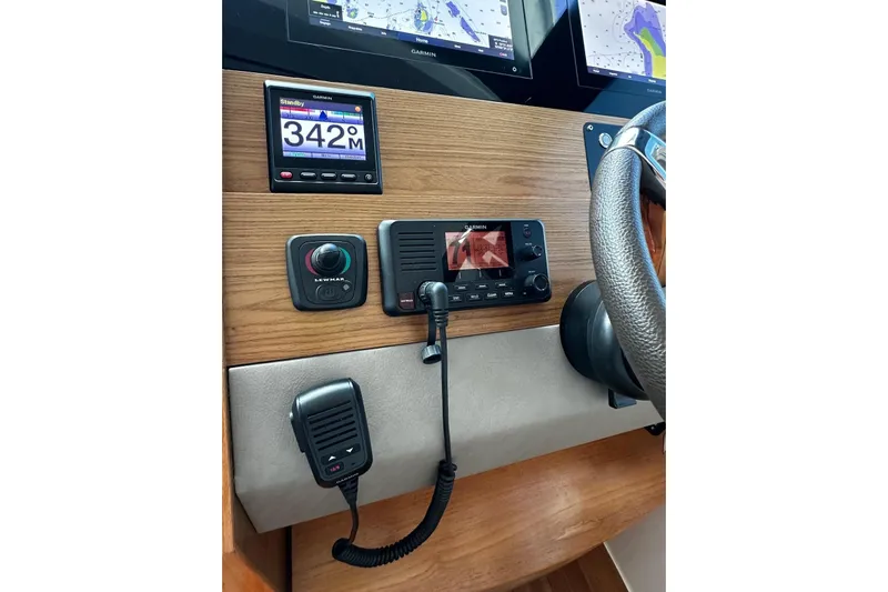  Yacht Photos Pics 2022 Tiara Yachts C39 Coupe helm with Garmin navigation and control systems.