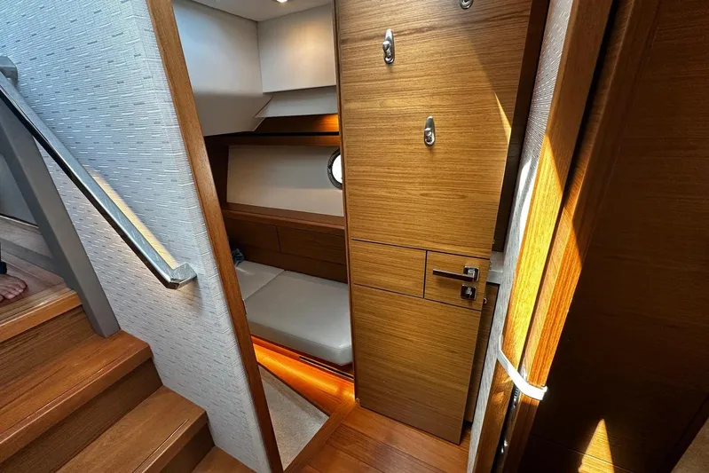  Yacht Photos Pics 2022 Tiara Yachts C39 Coupe interior with wooden finishes and cozy cabin space.