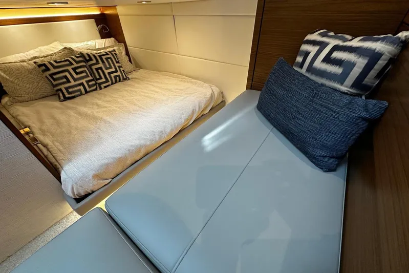  Yacht Photos Pics Luxurious interior of 2022 Tiara Yachts C39 Coupe with stylish bedding and cushions.