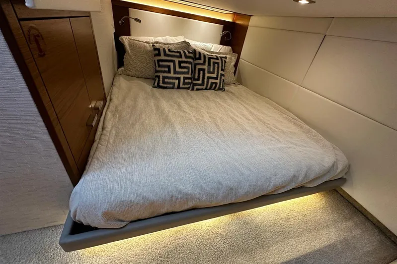  Yacht Photos Pics Luxurious bedroom interior of 2022 Tiara Yachts C39 Coupe with modern bedding and ambient lighting.