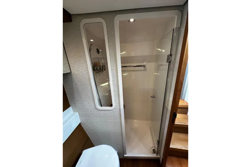  Yacht Photos Pics 2022 Tiara Yachts C39 Coupe bathroom with modern shower and sleek design.