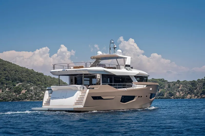 Numarine 26xp Yacht Photos Pics Luxurious 2025 Numarine 26XP yacht cruising on serene blue waters.