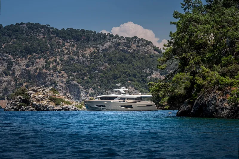 Numarine 26xp Yacht Photos Pics 2025 Numarine 26XP yacht cruising in scenic coastal waters with lush greenery.