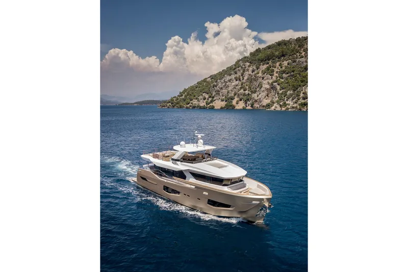 Numarine 26xp Yacht Photos Pics Luxurious 2025 Numarine 26XP yacht cruising in scenic blue waters near a lush coastline.