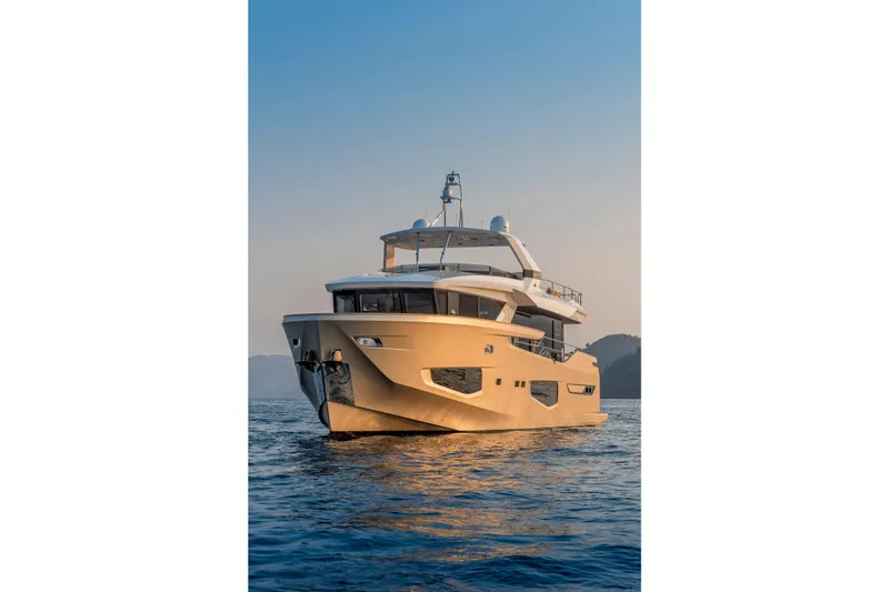 Numarine 26xp Yacht Photos Pics Luxurious 2025 Numarine 26XP yacht cruising on serene waters at sunset.