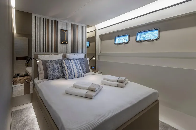 Numarine 26xp Yacht Photos Pics Luxurious bedroom interior of 2025 Numarine 26XP yacht with modern design and cozy bedding.