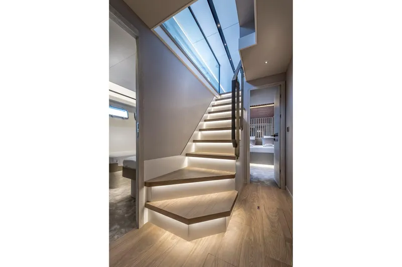 Numarine 26xp Yacht Photos Pics Modern interior staircase on 2025 Numarine 26XP yacht with sleek lighting and wooden finish.