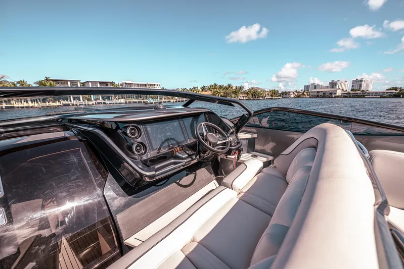  Yacht Photos Pics Luxurious 2022 Princess R Class 35 yacht interior with sleek dashboard and plush seating.