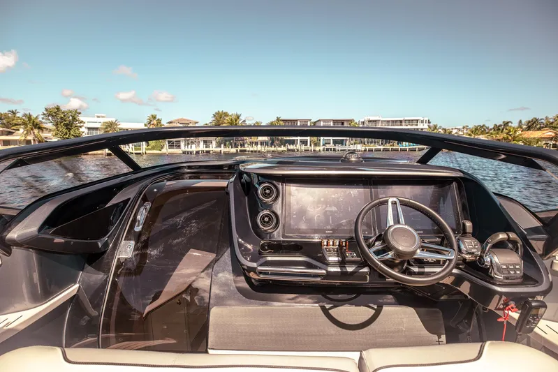  Yacht Photos Pics Luxurious 2022 Princess R Class 35 yacht cockpit with modern steering and navigation controls.