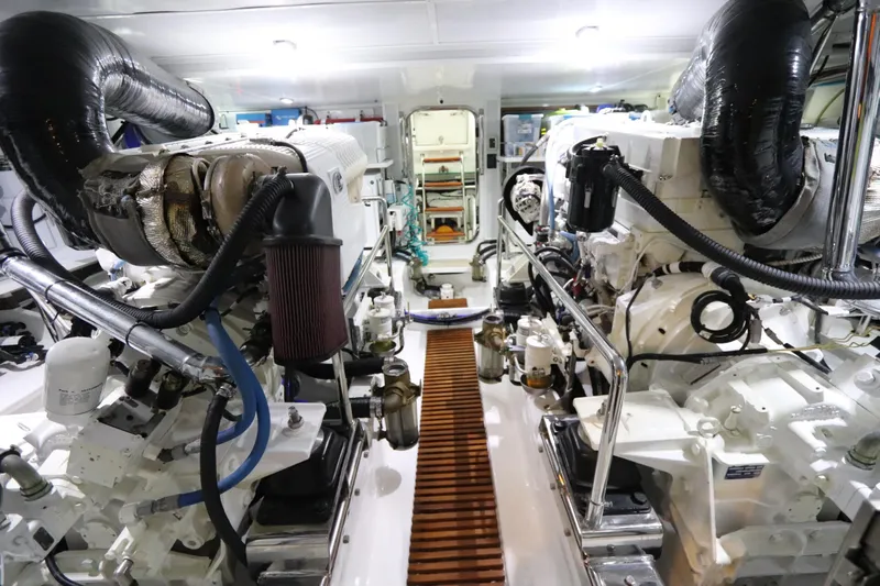 Mi Cielo Yacht Photos Pics Engine room of 2017 Marlow Explorer 49E yacht, showcasing dual engines and mechanical components.