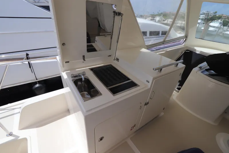 Mi Cielo Yacht Photos Pics Outdoor kitchen on 2017 Marlow Explorer 49E yacht with grill and sink.